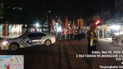 Sat Lantas Polres Tanjungbalai Kawal Pawai Lilin Waisak